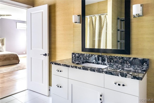 full bathroom featuring tile patterned floors, vanity, and a shower with shower curtain