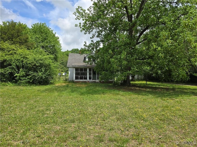 view of yard featuring a sunroom