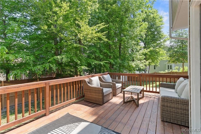 deck featuring an outdoor living space and fence