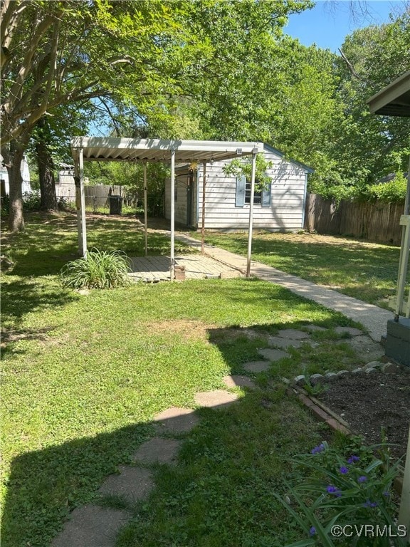 2307 Wright Ave, Richmond, VA 23224 - view of yard with a carport and an outdoor structure