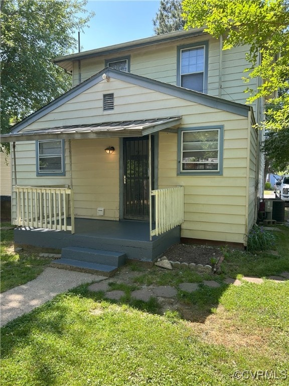 2307 Wright Ave, Richmond, VA 23224 - view of front of home featuring covered porch and a front yard