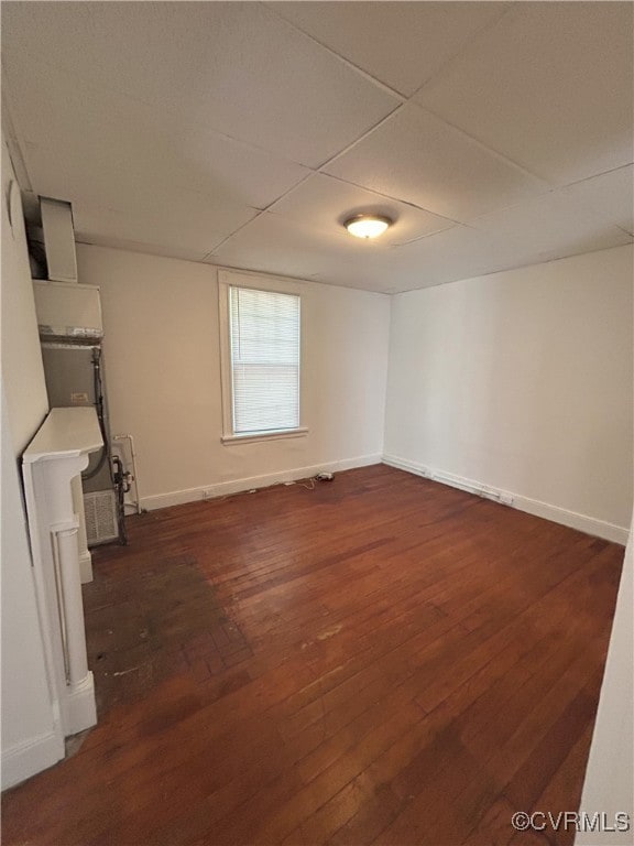 2307 Wright Ave, Richmond, VA 23224 - unfurnished living room featuring dark wood-style floors and a paneled ceiling