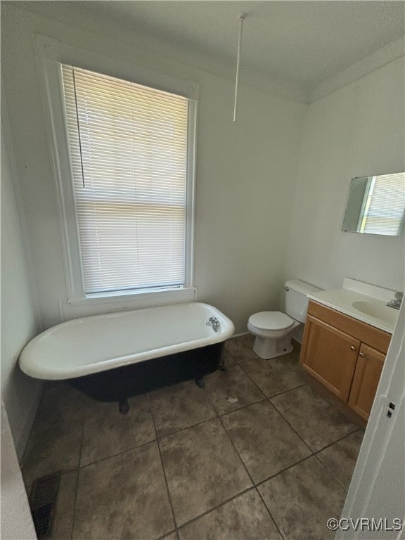 2307 Wright Ave, Richmond, VA 23224 - full bath with vanity, a freestanding tub, and tile patterned floors