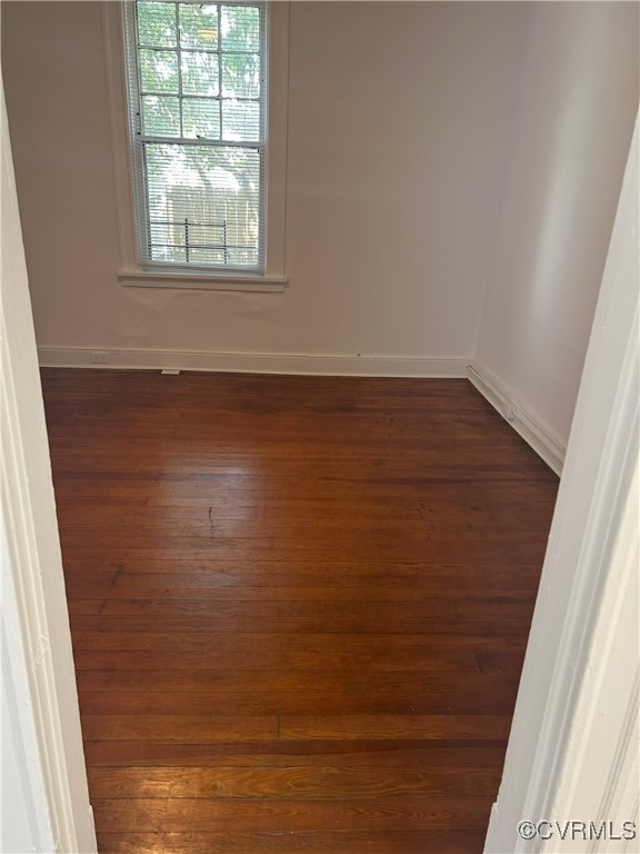 2307 Wright Ave, Richmond, VA 23224 - empty room featuring dark wood finished floors and baseboards