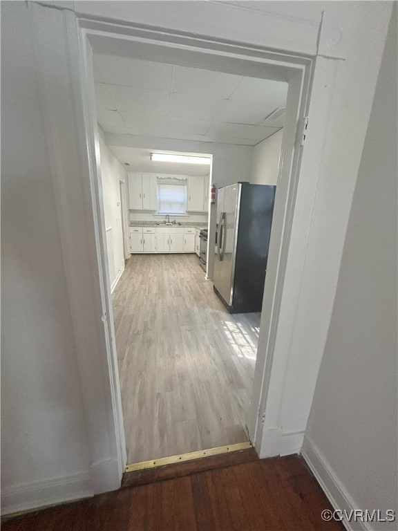 2307 Wright Ave, Richmond, VA 23224 - hall with light wood-type flooring and a sink