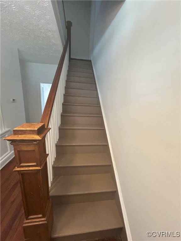 2307 Wright Ave, Richmond, VA 23224 - stairs with baseboards