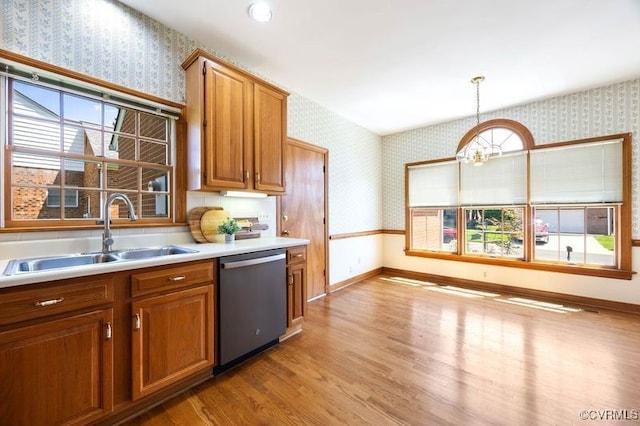 4916 Breckstone Pl, North Chesterfield, VA 23234 - kitchen featuring wallpapered walls, dishwasher, a sink, light wood finished floors, and brown cabinets