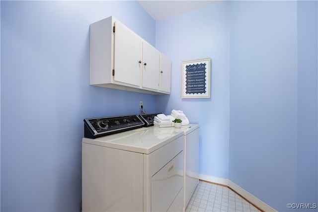 4916 Breckstone Pl, North Chesterfield, VA 23234 - washroom featuring washing machine and dryer, cabinet space, baseboards, and light tile patterned flooring