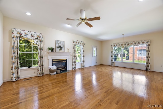 4916 Breckstone Pl, North Chesterfield, VA 23234 - unfurnished living room featuring a ceiling fan, a glass covered fireplace, light wood finished floors, baseboards, and recessed lighting