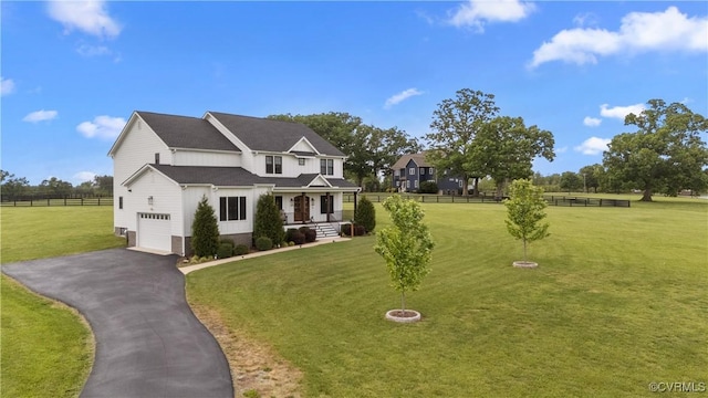 3307 Colston Ct, Powhatan, VA 23139 - view of front of home featuring a porch, aphalt driveway, fence, an attached garage, and a front lawn