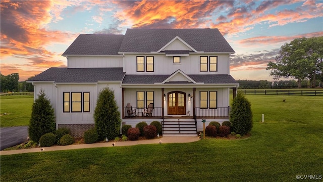 3307 Colston Ct, Powhatan, VA 23139 - modern farmhouse featuring a porch, a shingled roof, french doors, and a lawn