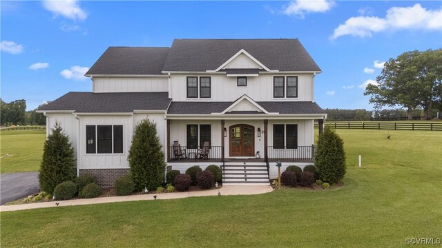 3307 Colston Ct, Powhatan, VA 23139 - view of front of property with a porch, a front yard, and board and batten siding