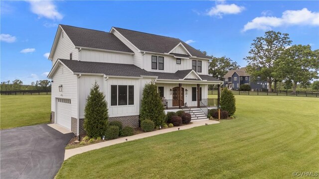 3307 Colston Ct, Powhatan, VA 23139 - view of front of home with board and batten siding, fence, and a garage