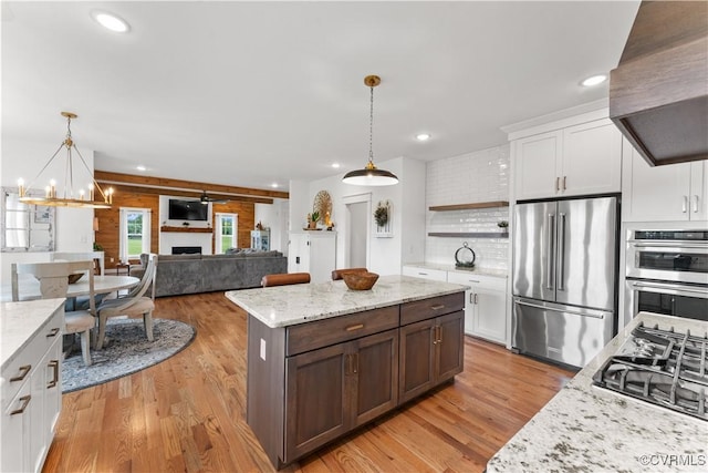 3307 Colston Ct, Powhatan, VA 23139 - kitchen featuring light wood finished floors, open shelves, stainless steel appliances, extractor fan, and white cabinetry
