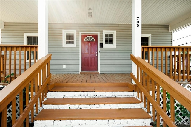 doorway to property featuring a porch
