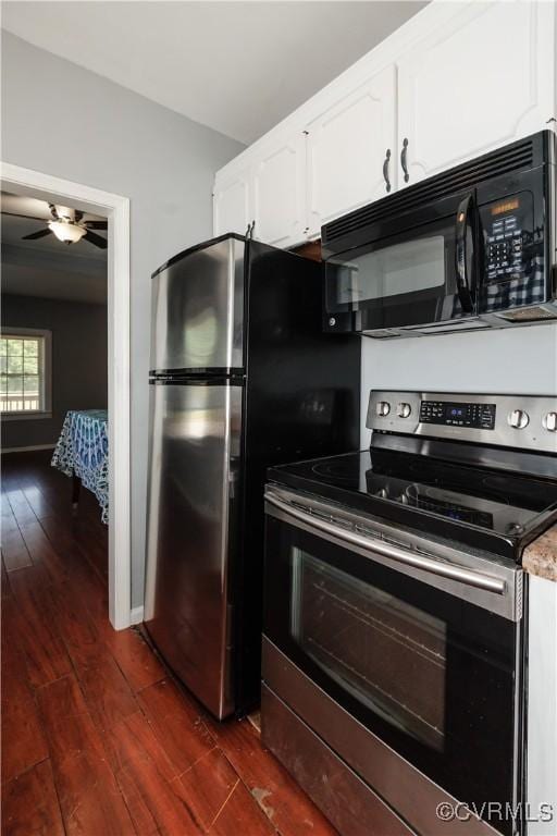 kitchen with electric stove, black microwave, dark wood-style floors, white cabinets, and a ceiling fan