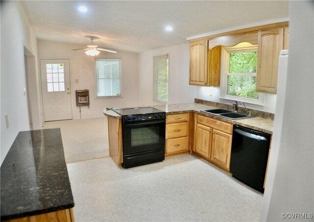 kitchen with a peninsula, a sink, light brown cabinets, ceiling fan, and black appliances