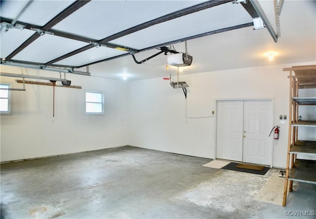 garage featuring a garage door opener