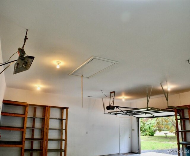 garage featuring a garage door opener