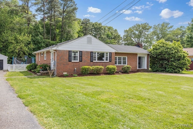 view of front of property with a chimney, brick siding, and crawl space