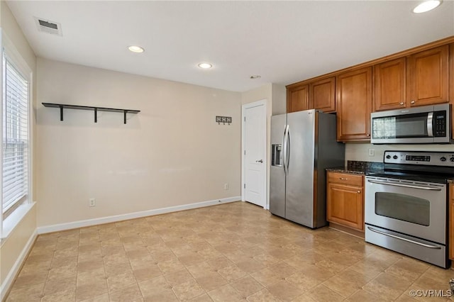5529 Frog Pond Ln, Virginia Beach, VA 23455 - kitchen featuring appliances with stainless steel finishes, visible vents, brown cabinets, and recessed lighting