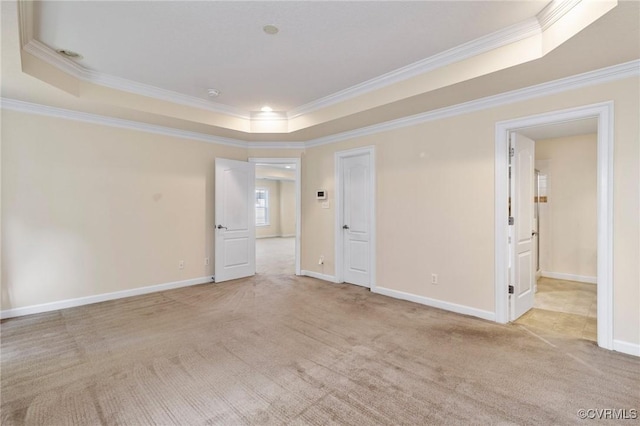 5529 Frog Pond Ln, Virginia Beach, VA 23455 - spare room featuring a tray ceiling, crown molding, light colored carpet, and baseboards