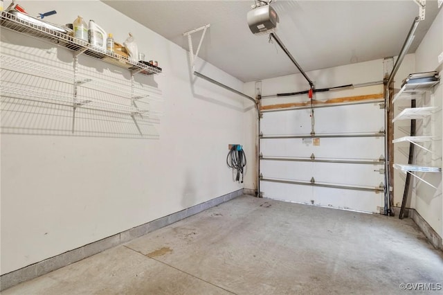 5529 Frog Pond Ln, Virginia Beach, VA 23455 - garage featuring baseboards and a garage door opener