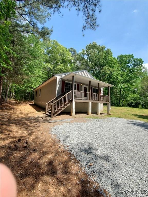 349 Whispering Pine Ln, Bumpass, VA 23024 - view of front facade with a porch and stairs