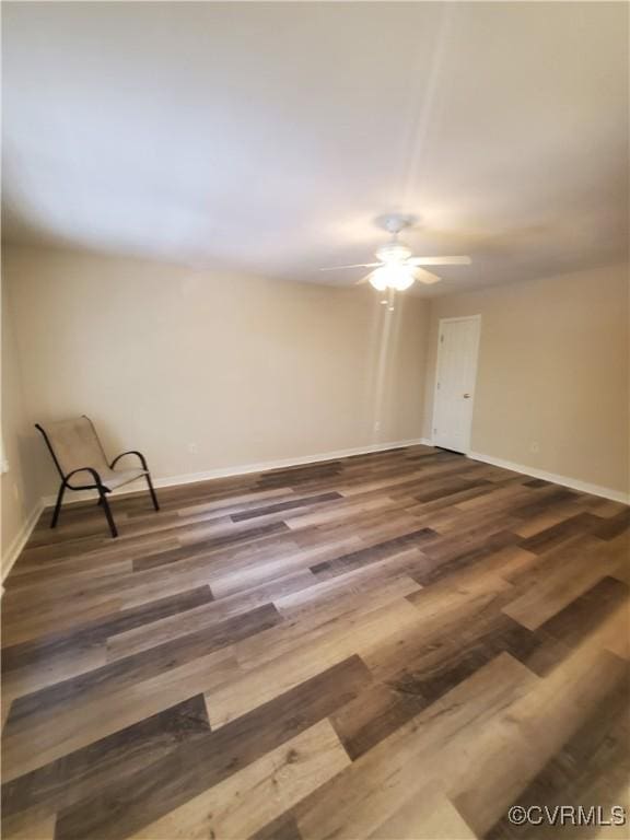 349 Whispering Pine Ln, Bumpass, VA 23024 - spare room featuring wood finished floors, ceiling fan, and baseboards