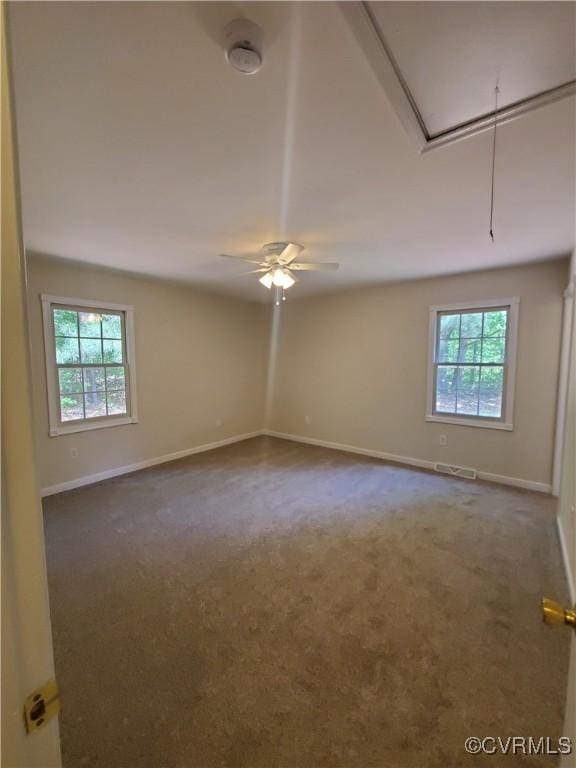 349 Whispering Pine Ln, Bumpass, VA 23024 - carpeted spare room with attic access, healthy amount of natural light, baseboards, and ceiling fan