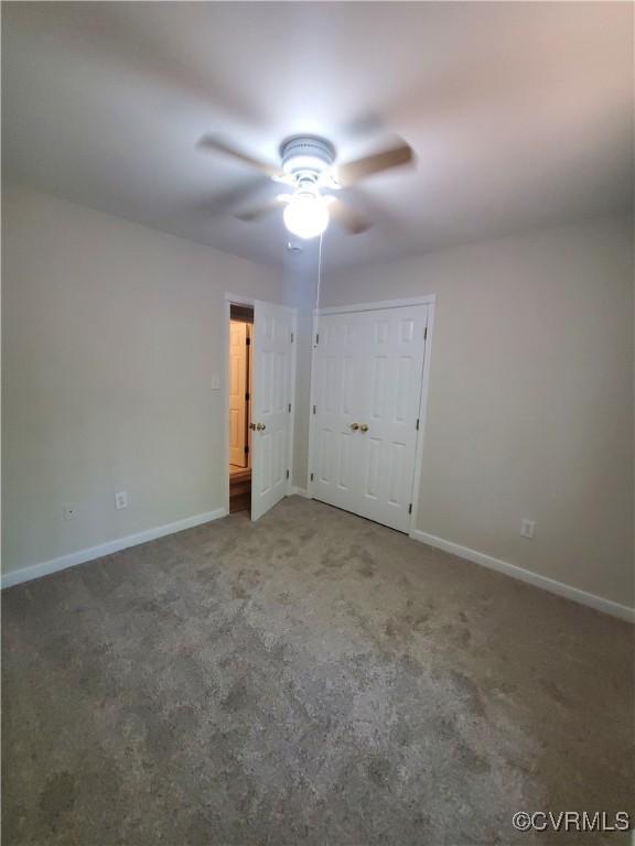 349 Whispering Pine Ln, Bumpass, VA 23024 - unfurnished bedroom with baseboards, carpet, and a ceiling fan