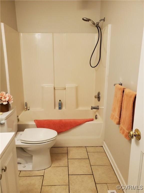 349 Whispering Pine Ln, Bumpass, VA 23024 - full bath featuring tile patterned floors, toilet, shower / washtub combination, and vanity