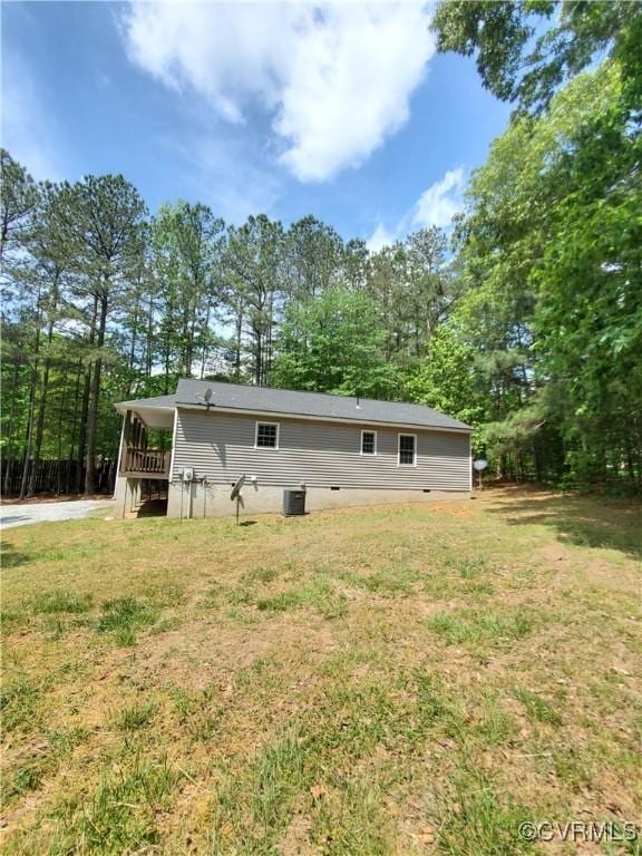 349 Whispering Pine Ln, Bumpass, VA 23024 - rear view of property with a yard and central AC