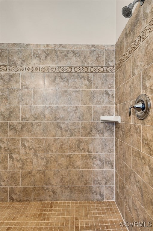 full bathroom with tiled shower