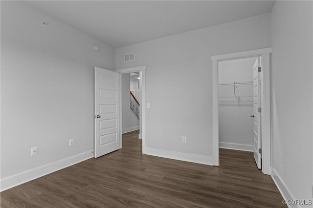 6 Flatwater Row Unit B, Henrico, VA 23231 - unfurnished bedroom with dark wood-style floors, a spacious closet, and a closet