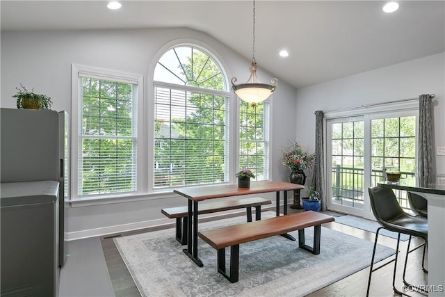 dining area featuring lofted ceiling, dark wood finished floors, recessed lighting, baseboards, and washing machine and clothes dryer