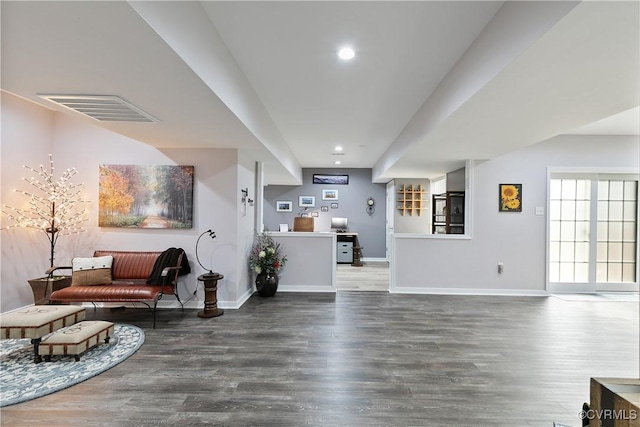 living room featuring wood finished floors, baseboards, and recessed lighting