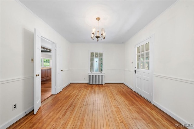33356 Richmond Tpke, Hanover, VA 23069 - unfurnished dining area with radiator, a chandelier, light wood-style flooring, and baseboards