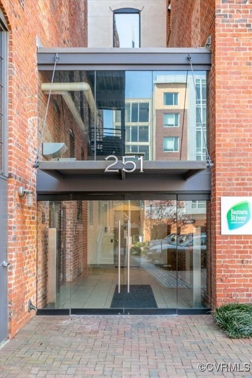 251 Rocketts Way Unit 204, Henrico, VA 23231 - doorway to property featuring brick siding