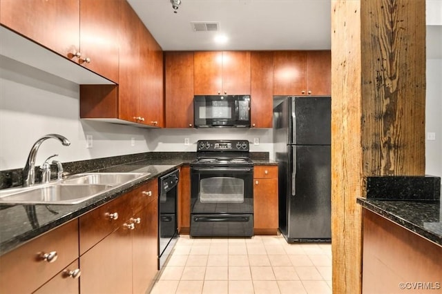 251 Rocketts Way Unit 204, Henrico, VA 23231 - kitchen with black appliances, a sink, light tile patterned floors, dark stone countertops, and brown cabinetry