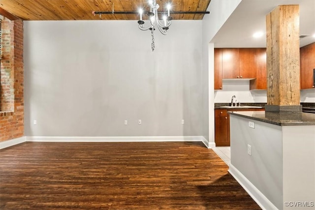 251 Rocketts Way Unit 204, Henrico, VA 23231 - unfurnished dining area with baseboards, wood finished floors, a sink, and wood ceiling