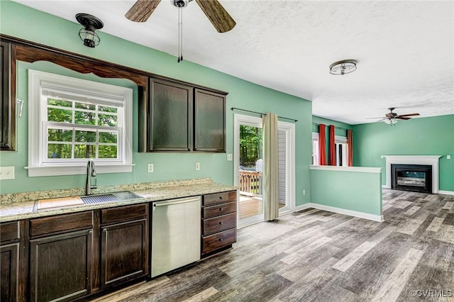 251 Ivy Glen Ln, Bumpass, VA 23024 - kitchen with stainless steel dishwasher, wood finished floors, ceiling fan, and a sink