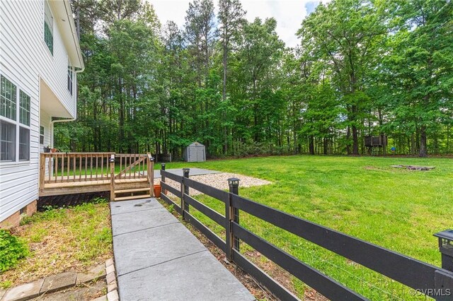 251 Ivy Glen Ln, Bumpass, VA 23024 - view of yard featuring a storage shed, an outbuilding, and a wooden deck