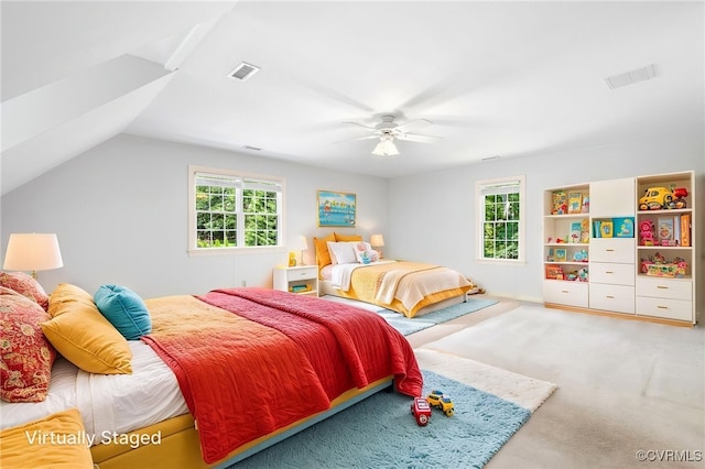 bedroom featuring carpet floors, a ceiling fan, and lofted ceiling