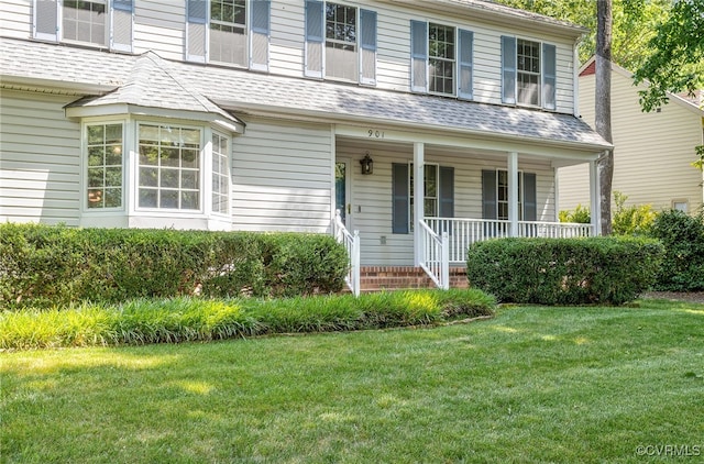 view of front of house featuring a porch and a front yard