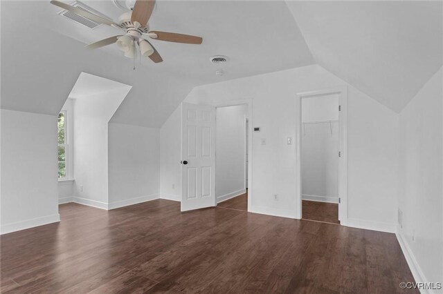 additional living space featuring vaulted ceiling, ceiling fan, visible vents, and wood finished floors