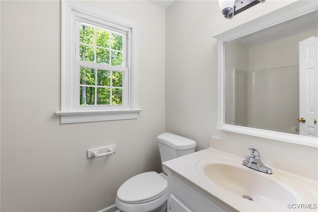 bathroom featuring toilet and vanity