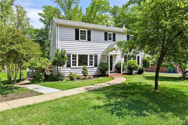 colonial home with a front yard