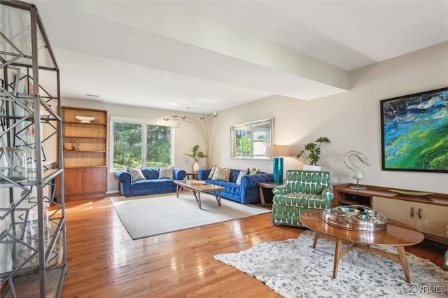 living room featuring wood finished floors and a healthy amount of sunlight