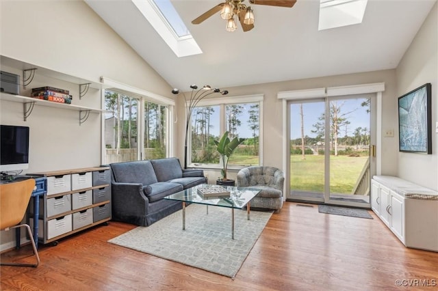 sunroom with a wealth of natural light and a skylight